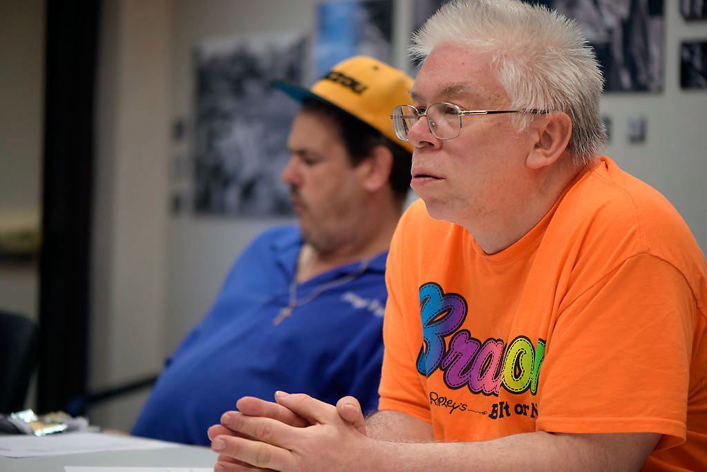 Donald Zawadzki listens to a fellow officer